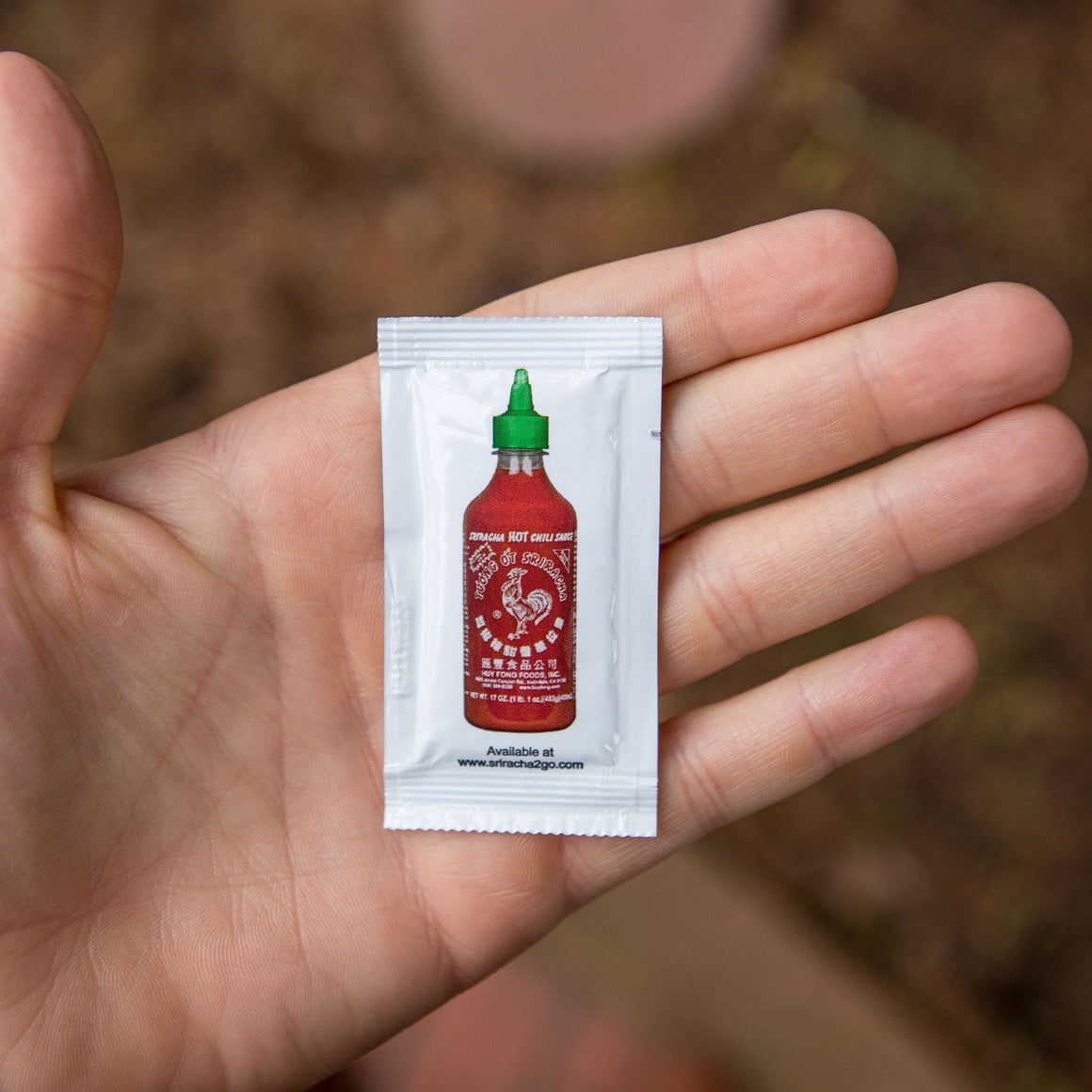Huy Fong Food Sriracha Packet In Hand