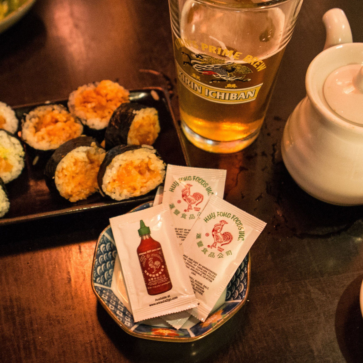 Sriracha Packets With Sushi Roll